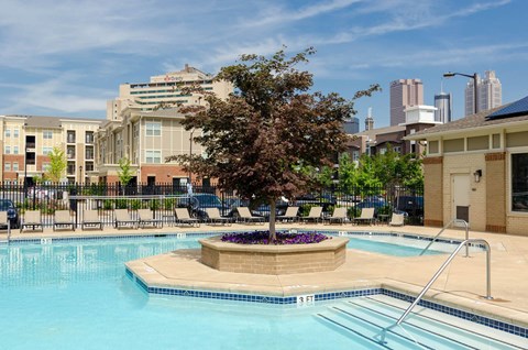 Swimming pool with sundeck and lounge chairs at Ashley Auburn Pointe in Atlanta, GA